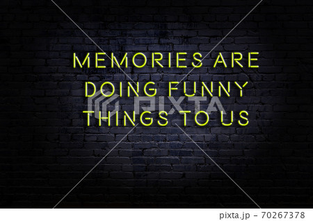 Wise quote. Neon inscription against brick wall 70267378