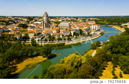 Aerial view of Saintes on Charente river with medieval cathedral, France 70270838