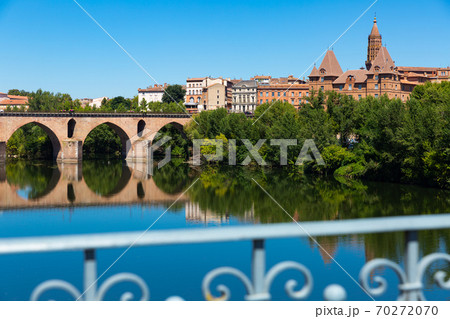 Medieval bridge over the Tarn river in Montauban city on sunny day 70272070