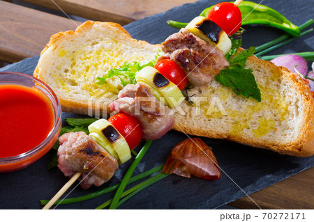 Mutton slices on barbecue skewers Mutton slices on barbecue skewers 70272171