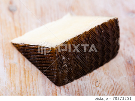 Piece of spanish hard cheese Anejo from sheep milk 70273251