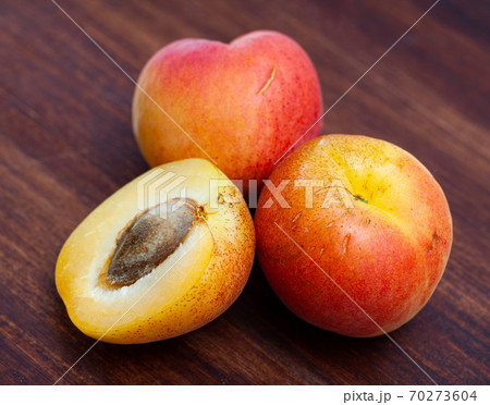 Fresh ripe apricots on wooden table 70273604