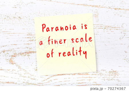 Yellow sticky note on wooden wall with wise quote 70274367