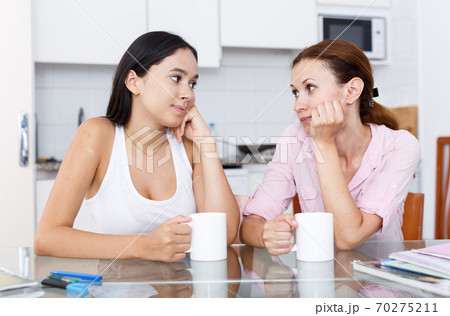 Mother and daughter talking Mother and daughter talking 70275211