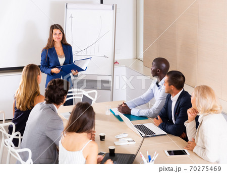 Woman making presentation on staff meeting 70275469