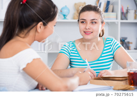 Teenagers girls studying at home 70275615