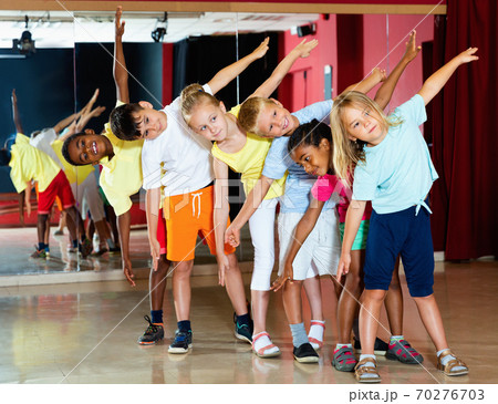 Happy emotional children posing at modern dance class Happy emotional children posing at modern dance class 70276703