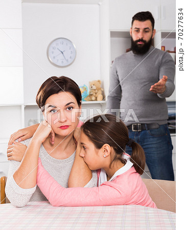 Father lecturing wife and daughter Father lecturing wife and daughter 70277634