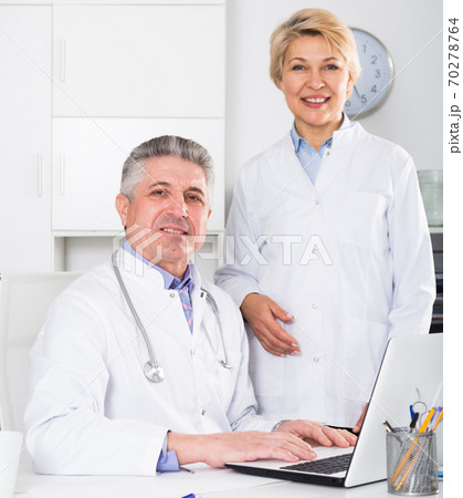 Doctor and nurse waiting for patients Doctor and nurse waiting for patients 70278764