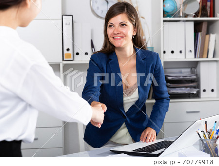 Businesswoman meetings female colleague Businesswoman meetings female colleague 70279918