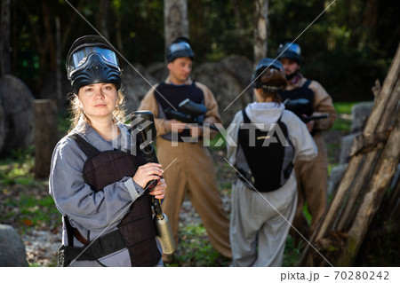Portrait of girl at paintball shooting range 70280242