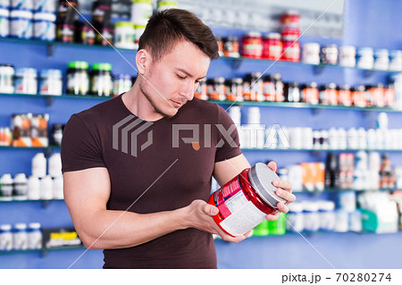 guy looking for necessary food supplements 70280274