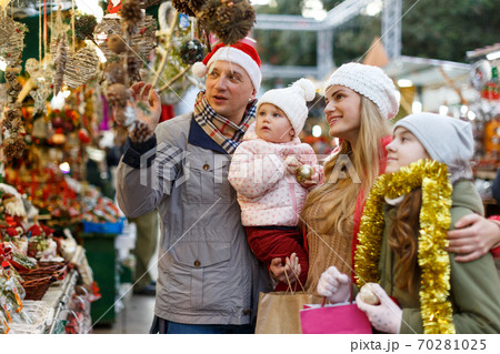 Family buying Christmas decorations Family buying Christmas decorations 70281025