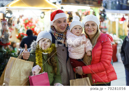 Family portrait at Christmas fair 70281056