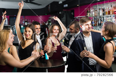 Friends dancing on celebratory party 70282566