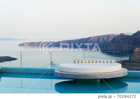 Pool and view of Santorini caldera Pool and view of Santorini caldera 70284272