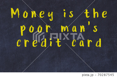 Chalk inscription of smart quote on black desk 70287545