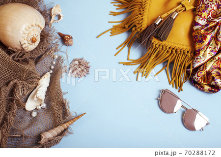 diverse travel girlish stuff on colorful background blue and yellow, nobody tourism lifestyle concept diverse travel girlish stuff on colorful background blue and yellow, nobody tourism lifestyle concept 70288172