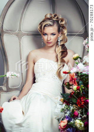 beauty young bride alone in luxury vintage interior with a lot of flowers, makeup and creative hairstyle beauty young bride alone in luxury vintage interior with a lot of flowers, makeup and creative hairstyle 70288173