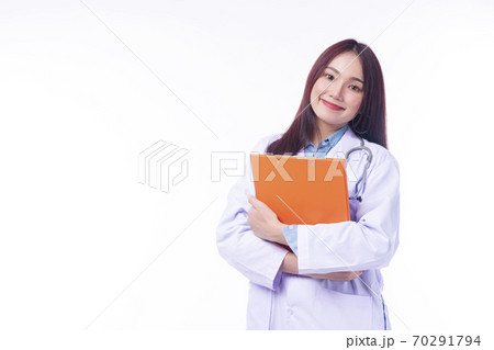 Cheerful young woman doctor in uniform with stethoscope holding clipboard  70291794