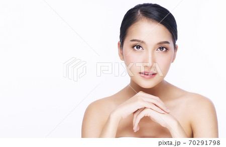 Lovely nice young woman make-up face holding her hand under the chin  70291798
