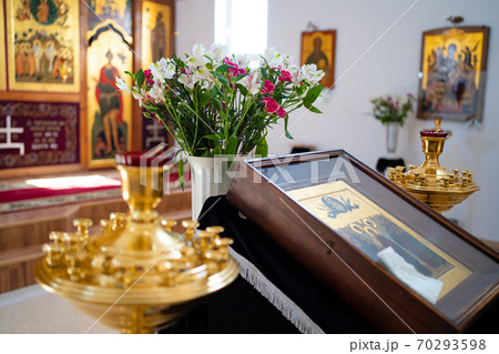 bouquet of flowers in Church lamps icons on ambo 70293598