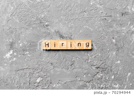 hiring word written on wood block. hiring text on table, concept 70294944