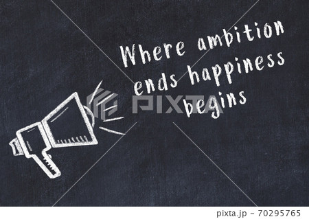 Chalk loudspeaker and wise quote on black desk Chalk loudspeaker and wise quote on black desk 70295765