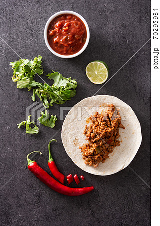 Mexican tacos ingredients on black stone 70295934