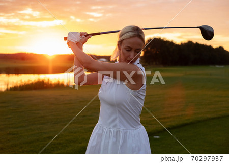 Focused Woman Get Ready to Hit Ball . 70297937