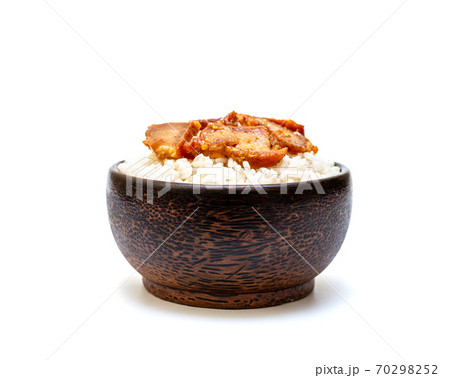 White rice with grilled pork in black bowl on white background White rice with grilled pork in black bowl on white background 70298252