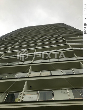 a beautiful tall white residential building 70298595