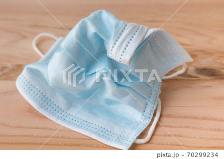 Wrinkled disposable face masks close up Wrinkled disposable face masks close up 70299234
