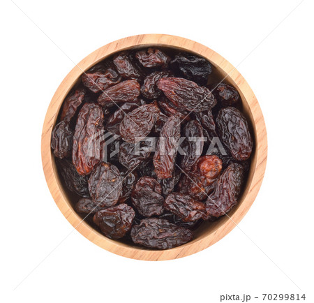 Top view of dried raisins isolated on white background Top view of dried raisins isolated on white background 70299814