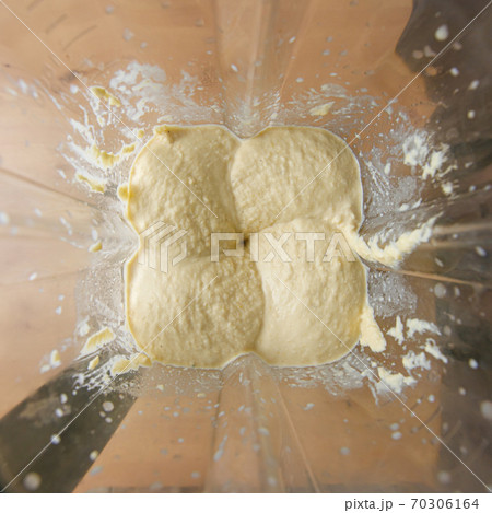 Top view of homemade hummus in blender Top view of homemade hummus in blender 70306164