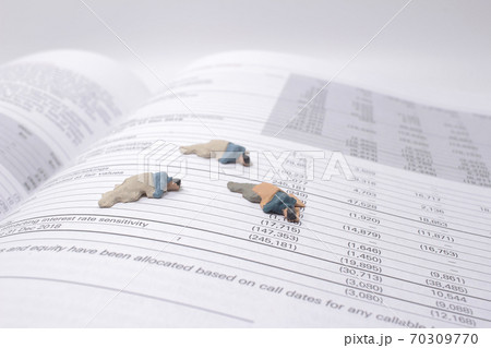 a social theme. Hungry homeless figure men on the book 70309770