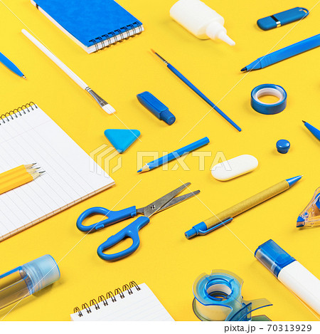 Assorted office and school white and blue stationery on yellow 70313929