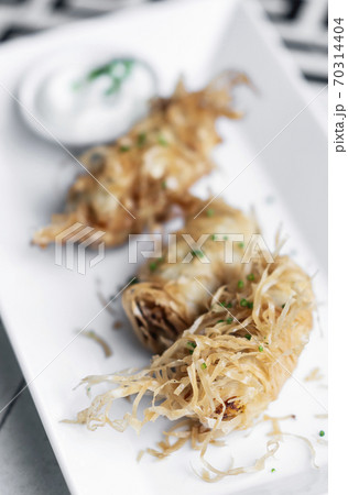 asian fried rice noodle shrimp spring rolls starter on plate asian fried rice noodle shrimp spring rolls starter on plate 70314404