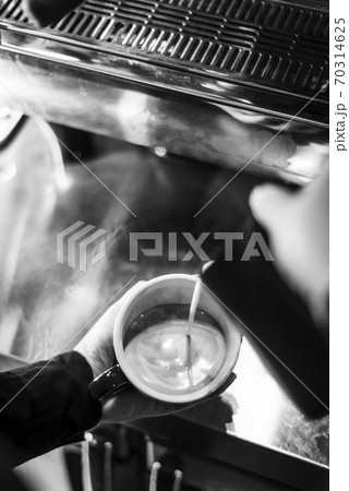 making espresso coffee close up detail with modern machine making espresso coffee close up detail with modern machine 70314625