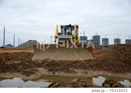 Track-type dozer for pool excavation and utility trenching. Bulldozer digging  70315072