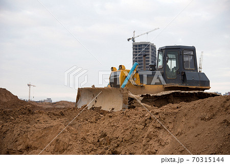 Bulldozer with bucket for pool excavation and utility trenching. Bulldozer with bucket for pool excavation and utility trenching. 70315144