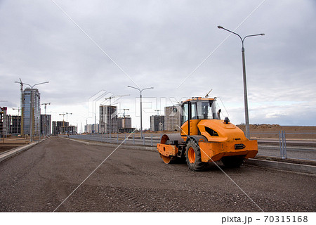 Soil Compactor at construction site. Vibration single-cylinder road roller for leveling soil Soil Compactor at construction site. Vibration single-cylinder road roller for leveling soil 70315168