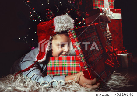 Boy with a Christmas gift 70316640