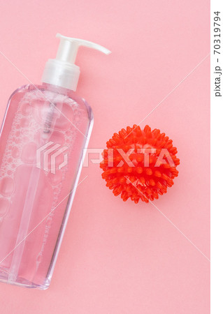 on pink bottle of antiseptic and model COVID-19 on pink bottle of antiseptic and model COVID-19 70319794