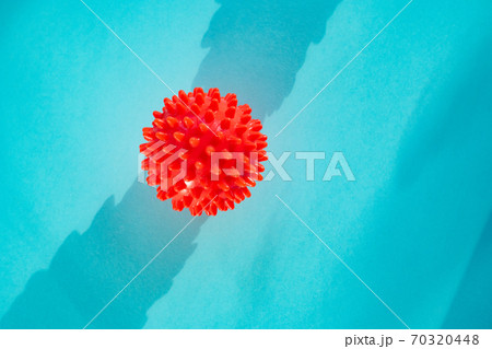 COVID-19 model of Coronavirus disease on blue COVID-19 model of Coronavirus disease on blue 70320448