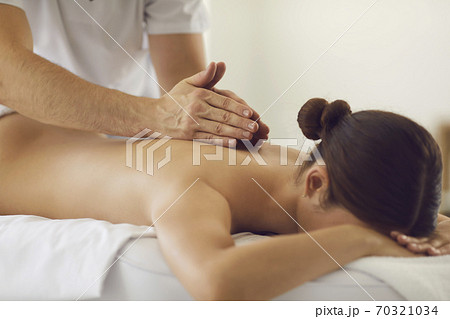 Female client getting relaxing professional medical massage in modern wellness center 70321034
