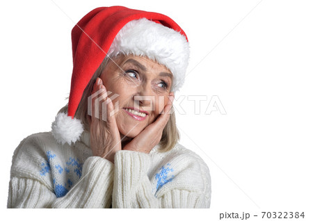 Senior woman in Santa hat isolated on white background 70322384