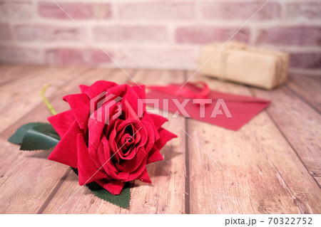gift box, envelope and rose flower on wooden background gift box, envelope and rose flower on wooden background 70322752
