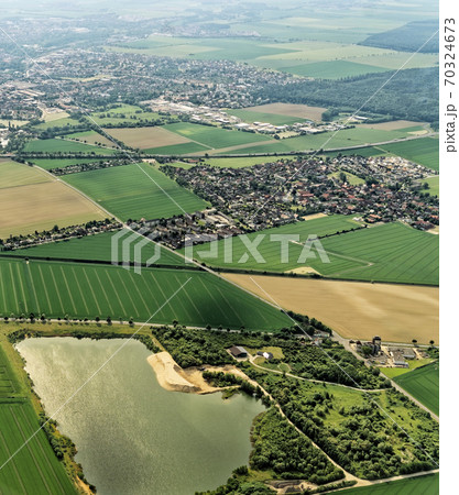 Suburb with a water-filled former gravel pit Suburb with a water-filled former gravel pit 70324673