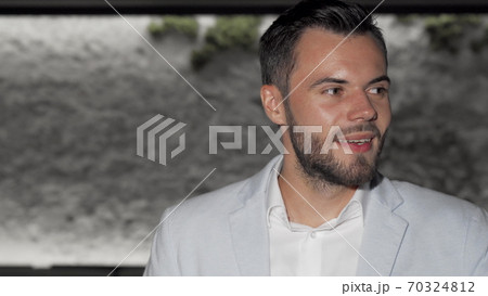 Attractive bearded man enjoying glass of red wine at the bar 70324812